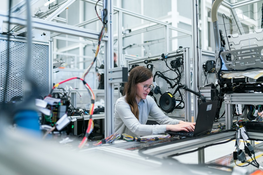 Engineer inspecting industrial equipment and sensor systems